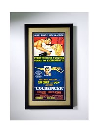The Ultimate James Bond Poster. "Goldfinger" Framed with Metalic Gold Mat