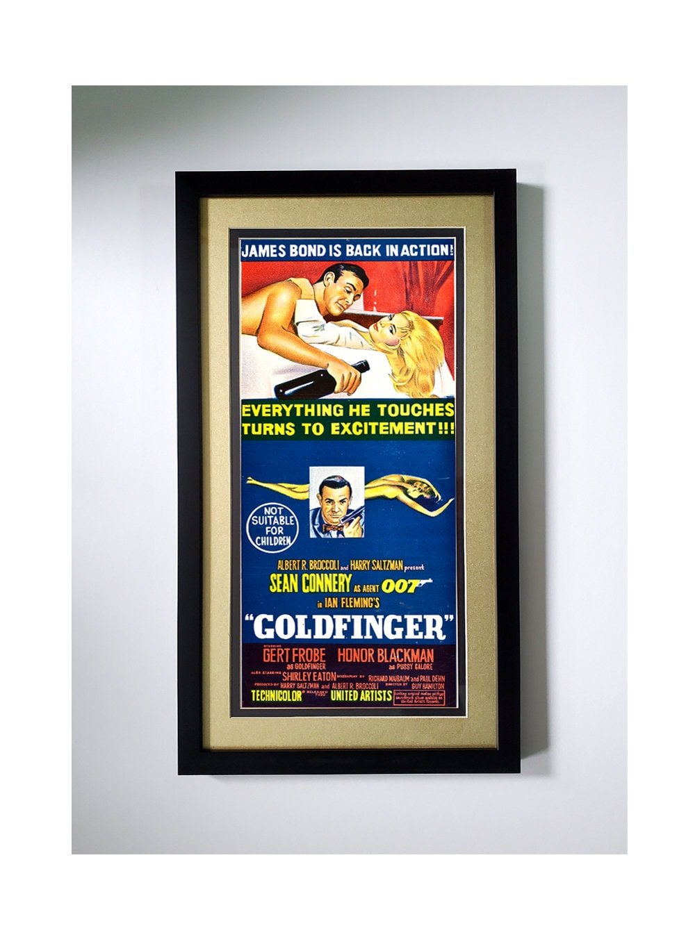 The Ultimate James Bond Poster. "Goldfinger" Framed with Metalic Gold Mat